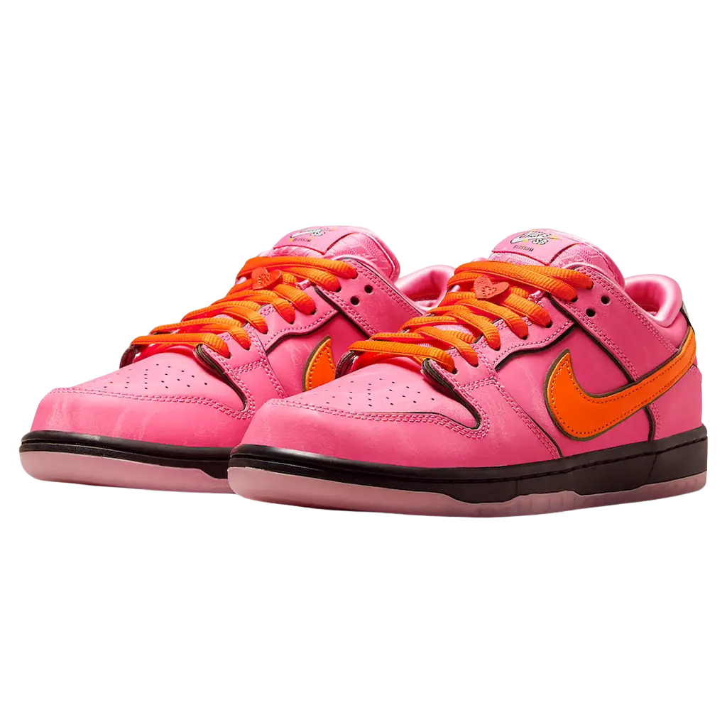 Pink sneakers with orange laces and Nike logo on a white background