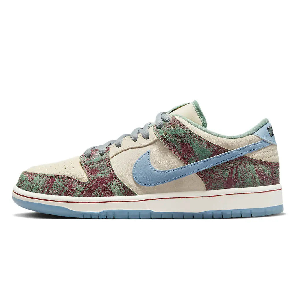 Sneaker with floral pattern and blue swoosh logo on a white background