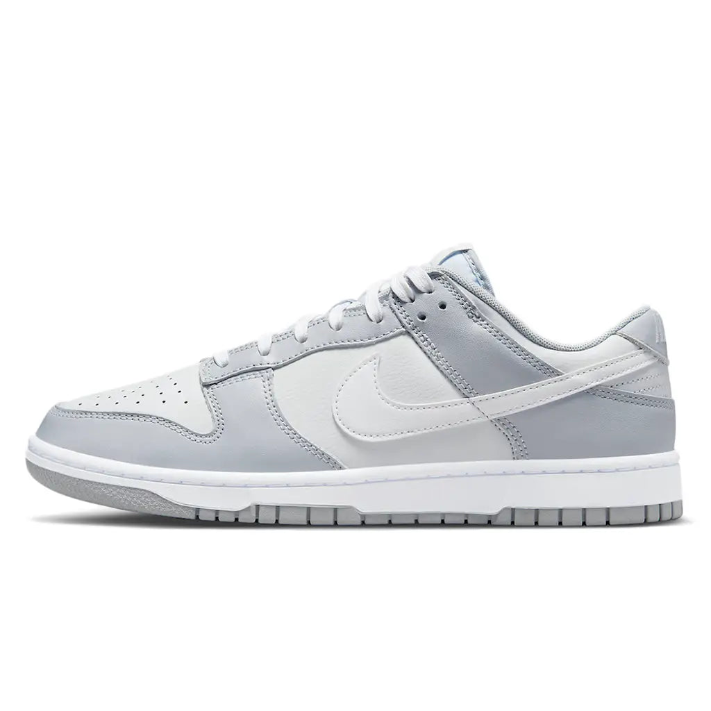 Gray sneaker with a white Nike logo on a white background