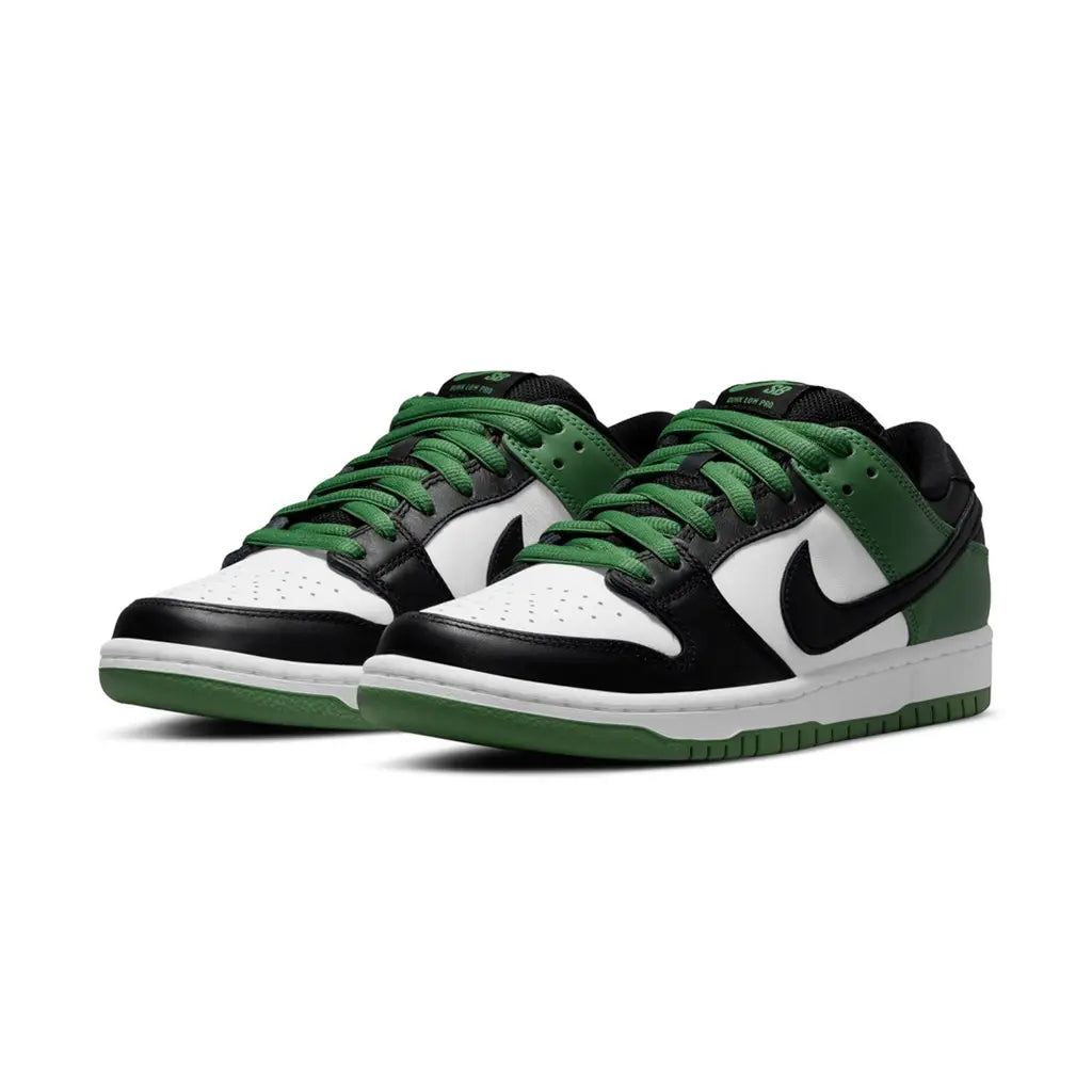 Green and black sneakers with white soles on a white background