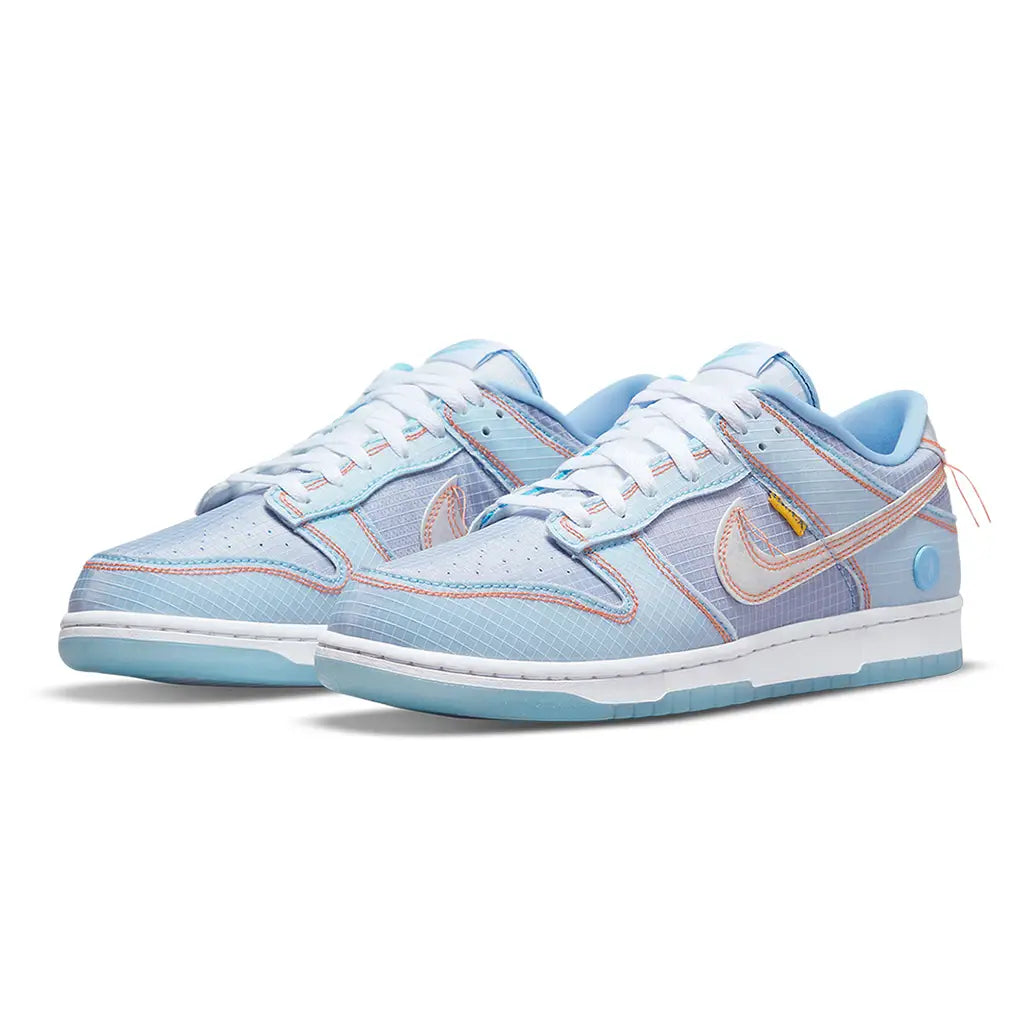 Light blue sneakers with a pink Nike logo on a white background