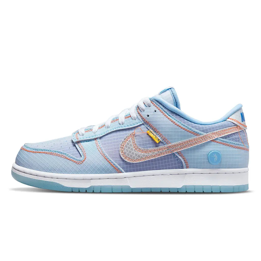 Light blue sneaker with pink accents on a white background